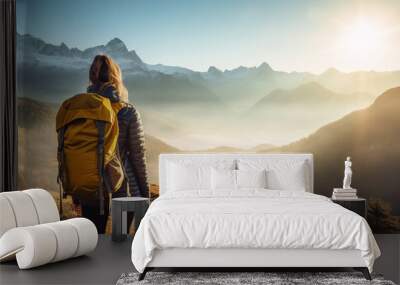 Female hiker traveling, walking alone mountains under sunset light. Woman traveler enjoys with backpack hiking in mountains. Travel, adventure, relax, recharge concept.. Wall mural