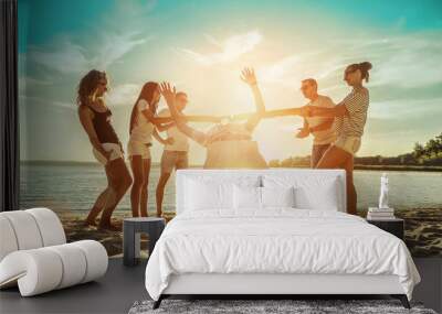 Happiness Friends funny game on the beach under sunset sunlight Wall mural