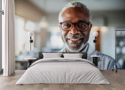 Happy Doctor, black man smiling in his office at the hospital, Portrait of male pediatrist doctor successful looking at camera Wall mural