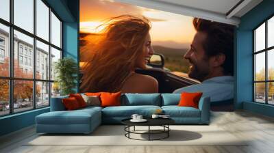 Happy smiling couple man and woman traveling in car convertible the Tuscany Italy on a summer day at sunset Wall mural