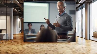 Professor, Teacher Man 55 years old with grey hair giving a lecture at university  in big classroom at high school before many sitting students, Expert Does Motivational Talk. Wall mural