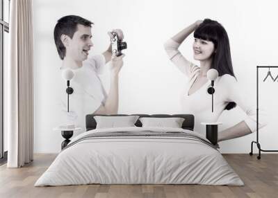 young beauty couple with photo camera isolated on white backgrou Wall mural