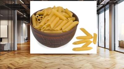 Italy dry raw pasta penne rigate in the bowl. Closeup on a white background Wall mural