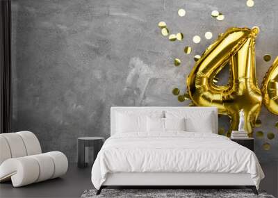 Yellow foil balloon number, number forty four concrete background. Greeting card with the inscription 44. Anniversary concept. for anniversary, birthday, new year celebration. banner Wall mural