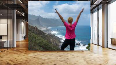 Woman hiker watching beautiful costal scenery. - Tenerife, Canary Islands, Spain. coast view, Wall mural