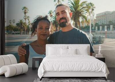 Close-up of interracial smiling couple in love Wall mural