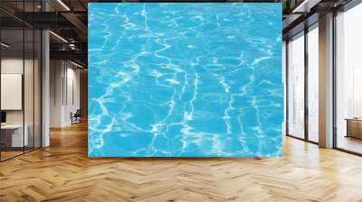 Beautiful surface of swimming pool water with rippling sunny wavy glowing blue transparent water. Abstract water surface with waves background Wall mural