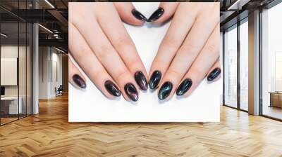 Closeup top view of professional colorful glossy brilliant holiday manicure at fingers of young woman. Modern trendy shiny amazing cat eye effect nail design. Horizontal color photography. Wall mural