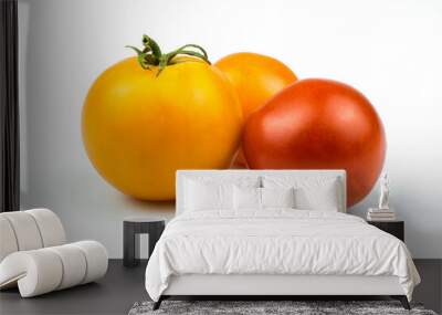 Ripe yellow and red tomatoes close-up isolated on a white background. Wall mural