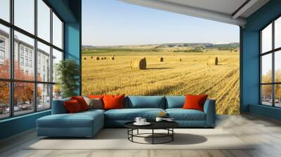 Bales of hay in a large field. Wall mural