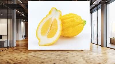 Typical sicilian lemon Piretto and its cutted slice isolated on white background Wall mural