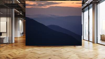 sunset in the mountains line of blue beautiful mountains Wall mural