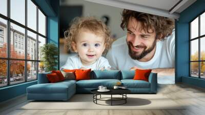 Father and child share joyful moments while playing with colorful toys indoors Wall mural