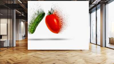 Tomato and cucumber exploding (dispersing) on white background Wall mural