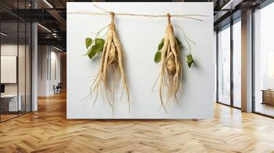 two dried ginseng roots hanging on a white background, in the style of strong facial expression created with Generative Ai Wall mural