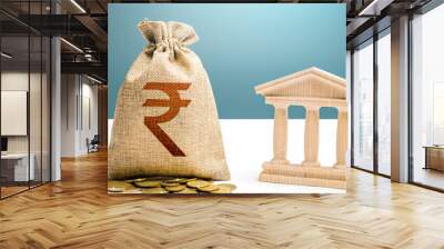 Indian rupee money bag and bank / government building. Budgeting, national financial system. Resource allocation. Support businesses in crisis. Lending loans, deposits. Monetary policy. Wall mural