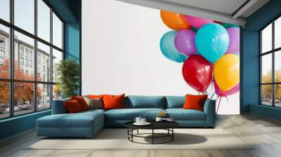 A bunch of colorful helium balloons tied together bring joy to the festive celebration, brightening the event. Wall mural