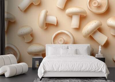 A close up of many mushrooms on a tan background. The mushrooms are all different sizes and shapes Wall mural