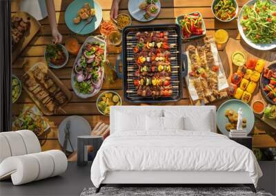 A delightful picnic with friends, featuring a variety of grilled skewers, meats, and fresh vegetables. Wall mural