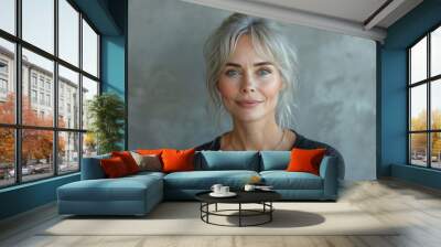 A happy, mature Caucasian woman, a portrait of ageless beauty and confidence outdoors with a cheerful demeanor. Wall mural