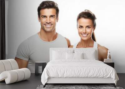 A happy and smiling sporty couple, a man and a woman, showcasing a healthy and fit lifestyle. Wall mural