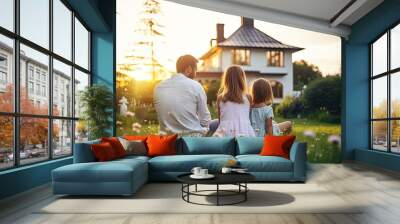 A happy family enjoying a summer day outdoors in a public park, with parents, daughters. Wall mural