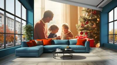 A man sits with two children in front of a Christmas tree. Scene is warm and festive, as the family is gathered together to celebrate the holiday season Wall mural