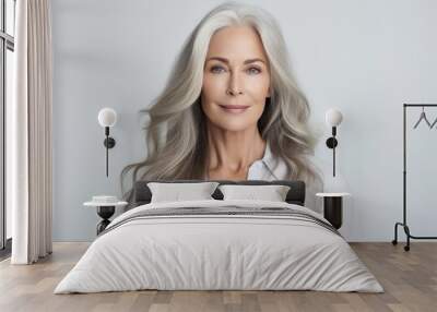 A senior Caucasian woman with elegant gray hair, exuding confidence and natural beauty in a portrait Wall mural