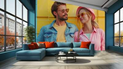 A stylish, happy couple embraces outdoors, radiating joy and closeness in their trendy urban adventure Wall mural