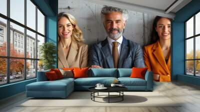 Diverse business team led by a businessman and businesswoman, sitting together in a corporate office. Wall mural