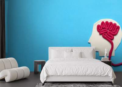 Figure of man with brain and red heart. Love and intelligence. Wall mural