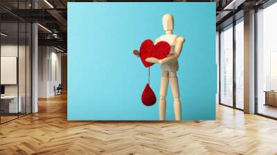 Figure of people with red heart and drop. Blood donor. Medical donation and blood transfusion. Wall mural