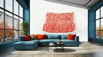 Fresh minced meat on a white plate, ground beef. Wall mural