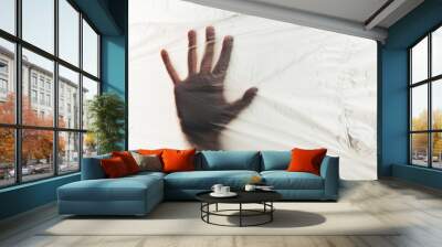 Human hand on background of plastic trash polluting planet. Stop the use of plastic packaging and bags. Wall mural