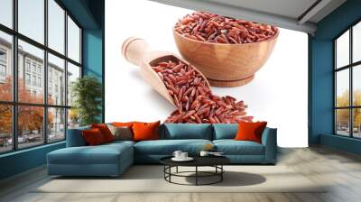 red rice in a wooden bowl isolated on white Wall mural