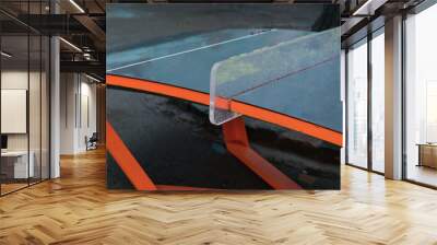 Curved table for the modern sport of teqball or teqpong during the rain. A mixture of table tennis and football. Bending. Rounded. Pong. Day. Recreational Sports. Recreation. Bounce. Combining Wall mural