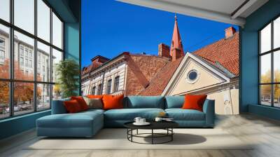 Roofs of the old town with a church tower in the background  Wall mural