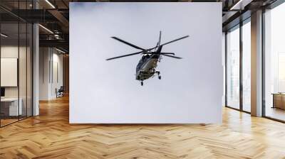 a nice shot of helicopter in flight Wall mural