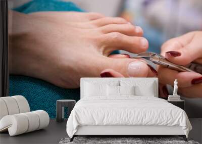 a man and  the procedure of pedicure Wall mural