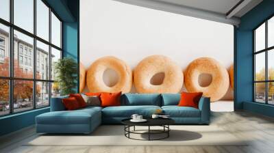 Drying or mini round bagels on a white wooden background. Copy, empty space for text Wall mural