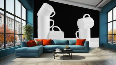 Arrangement of six white mugs with a handle. Black background Wall mural