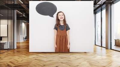 portret emotional 7 year old girl on white background. baby girl shows the emotion of fun. mock up on wall Wall mural