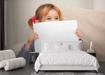 happy girl with white sheet in hands Wall mural