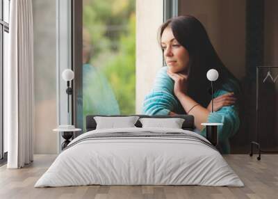 woman sitting on the window sill Wall mural