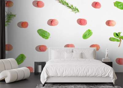 Fresh lychee fruits with rosemary and mint leaves on white background. Minimal style composition. Healthy food concept. Summer refreshment theme Wall mural