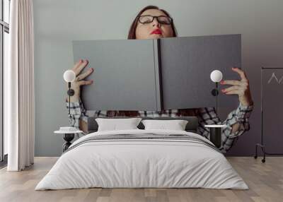 Business woman holding a book Wall mural