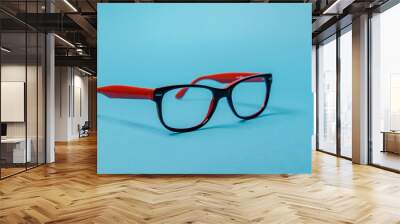 pair of red plastic-rimmed eyeglasses Wall mural