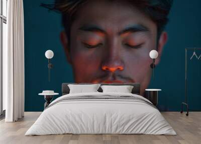 A young man from Nepal, in candle light meditating.  Wall mural