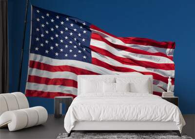 American Flag Waving In Wind Against a Deep Blue Sky. Wall mural