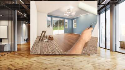 Before and After of Man Painting Roller to Reveal Newly Remodeled Room with Fresh Blue Paint and New Floors. Wall mural